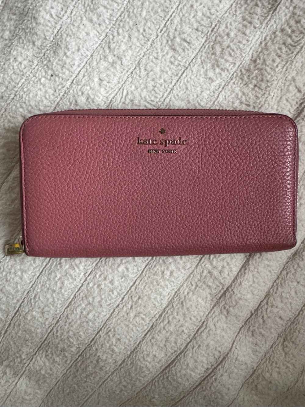 kate spade pebbled zip-around wallet in dusty rose